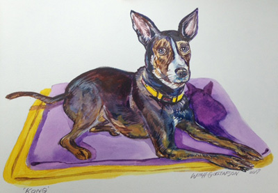 Portrait of a black dog laying on yellow and purple towels
